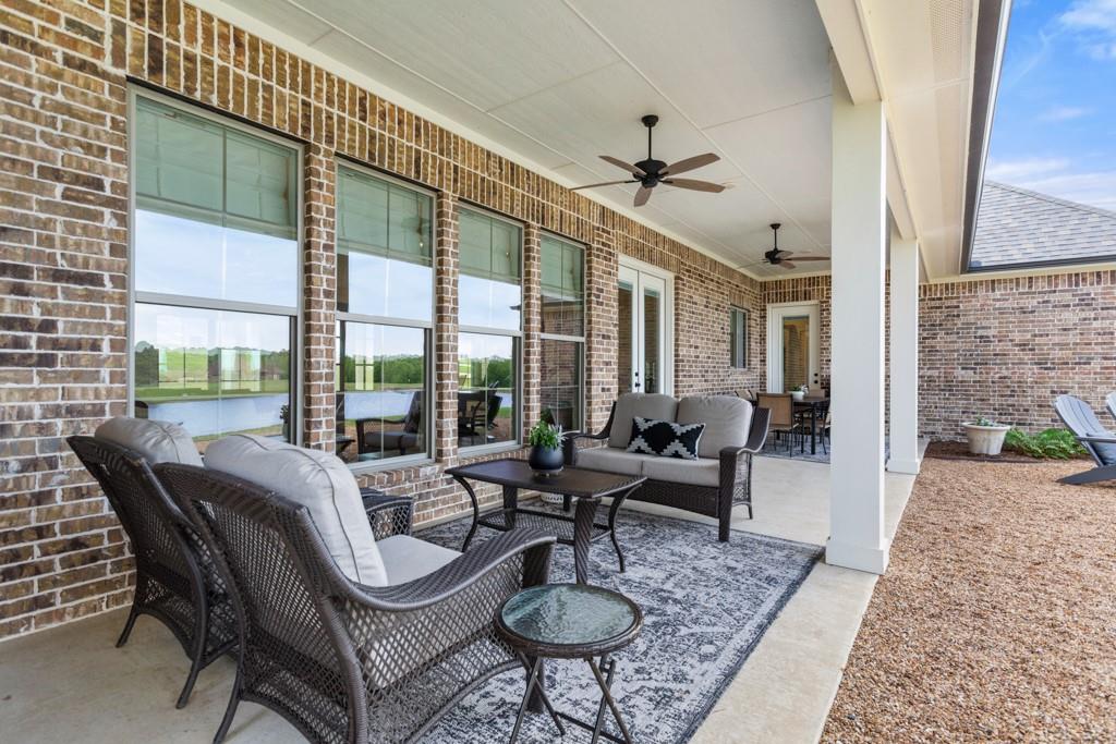 23630 Champion Drive Lindale, TX 75771 - Photo 30 of 36 a living room with furniture and a large window