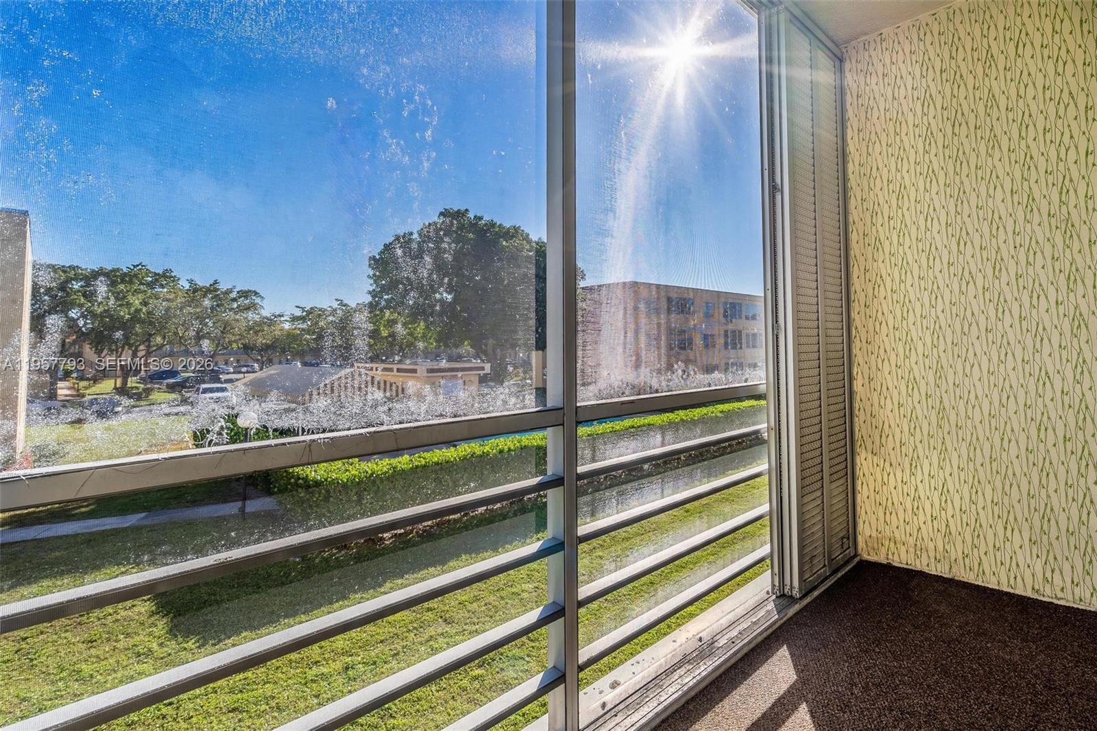 200 Ashbury Road, Unit 205 Hollywood, FL 33024 - Photo 30 of 41 Garden and pool view