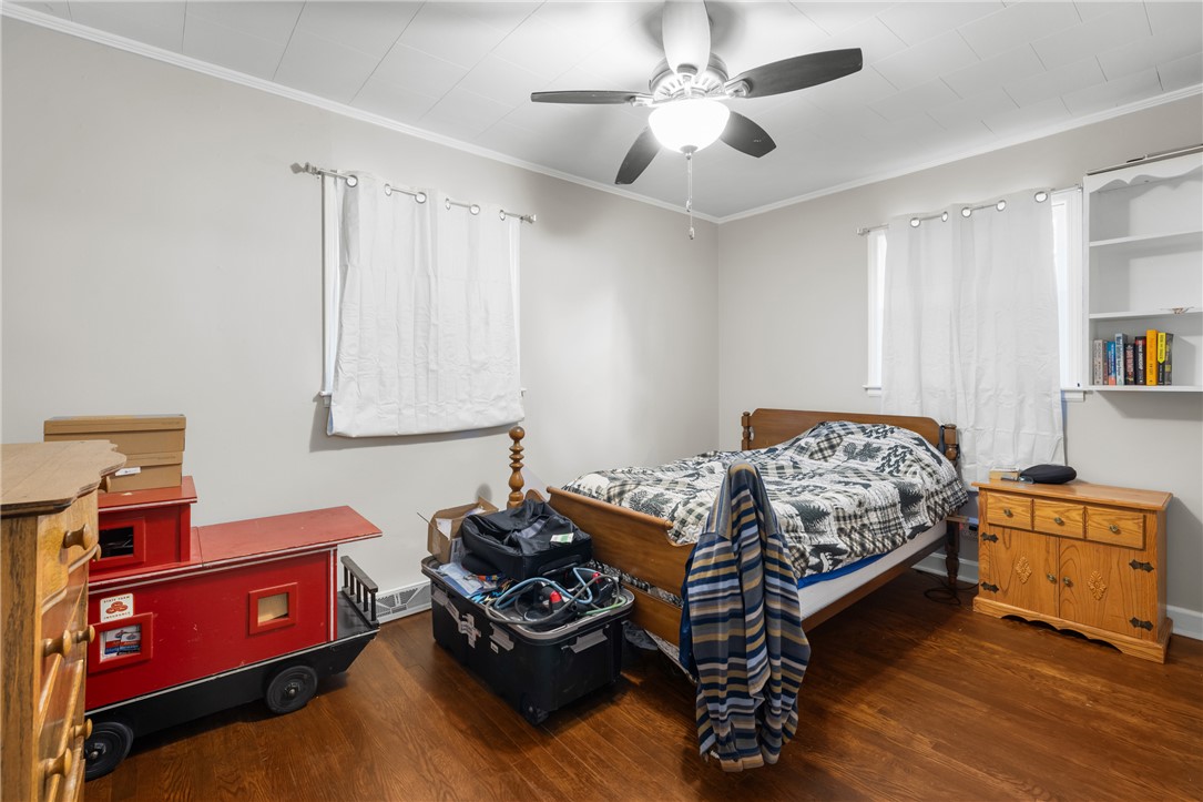308 Buchanan Circle Pendleton, SC 29670 - Photo 12 of 19 This cozy bedroom features polished wood floors and a convenient ceiling fan for comfort.
