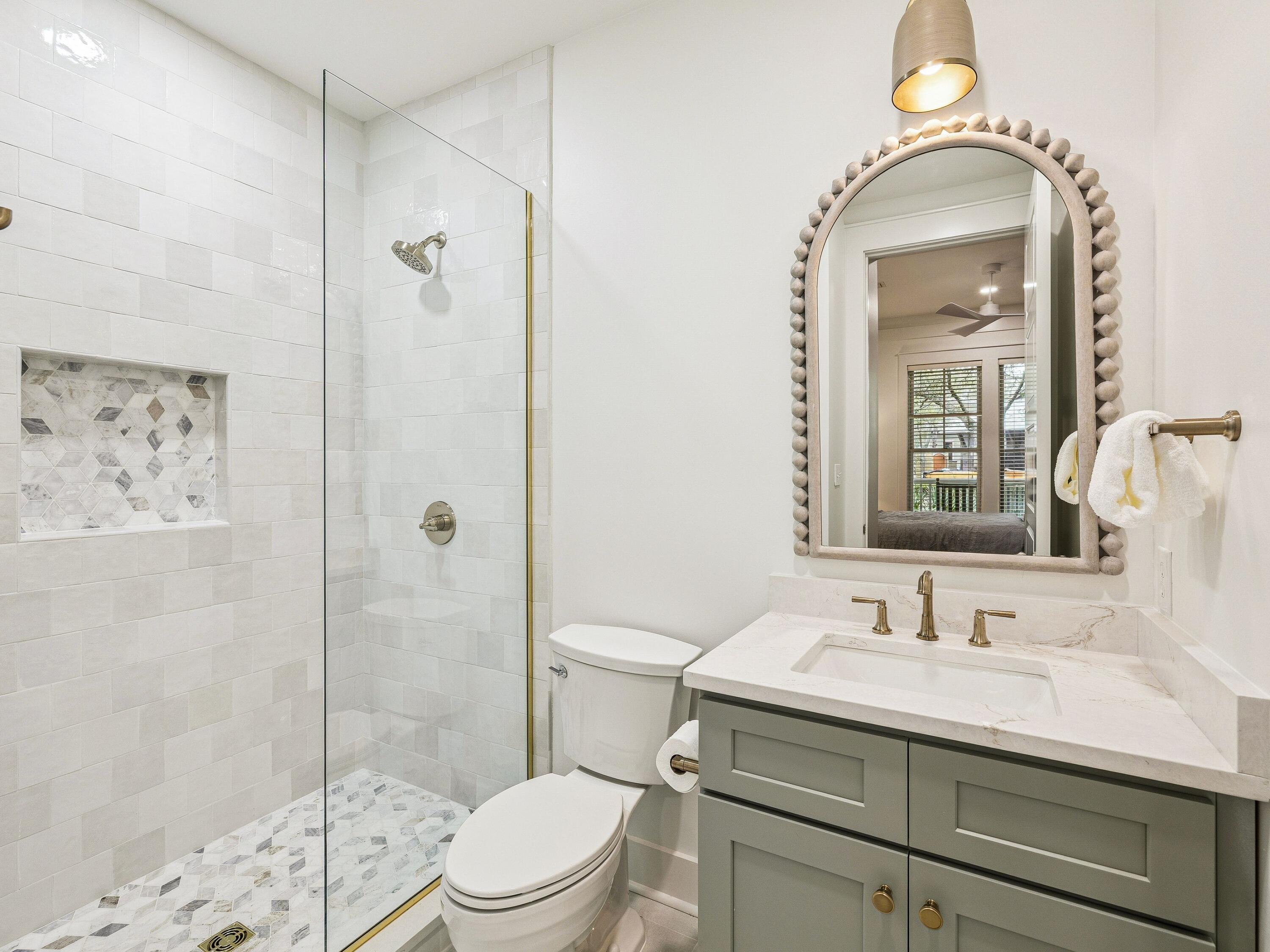 90 Silver Laurel Way Santa Rosa Beach, FL 32459 - Photo 14 of 45 a bathroom with a sink a toilet and shower