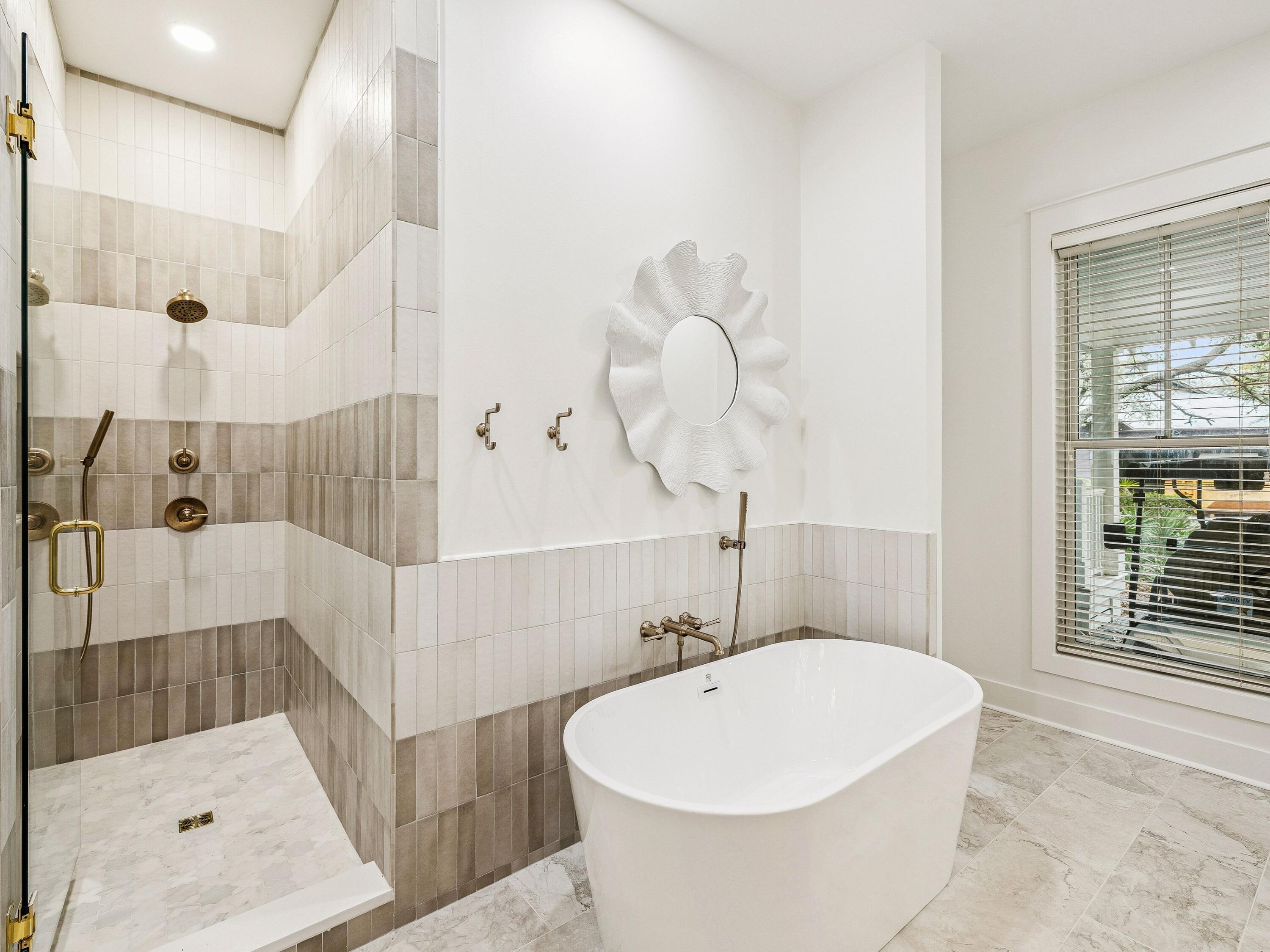 90 Silver Laurel Way Santa Rosa Beach, FL 32459 - Photo 24 of 45 a bathroom with a bathtub and shower