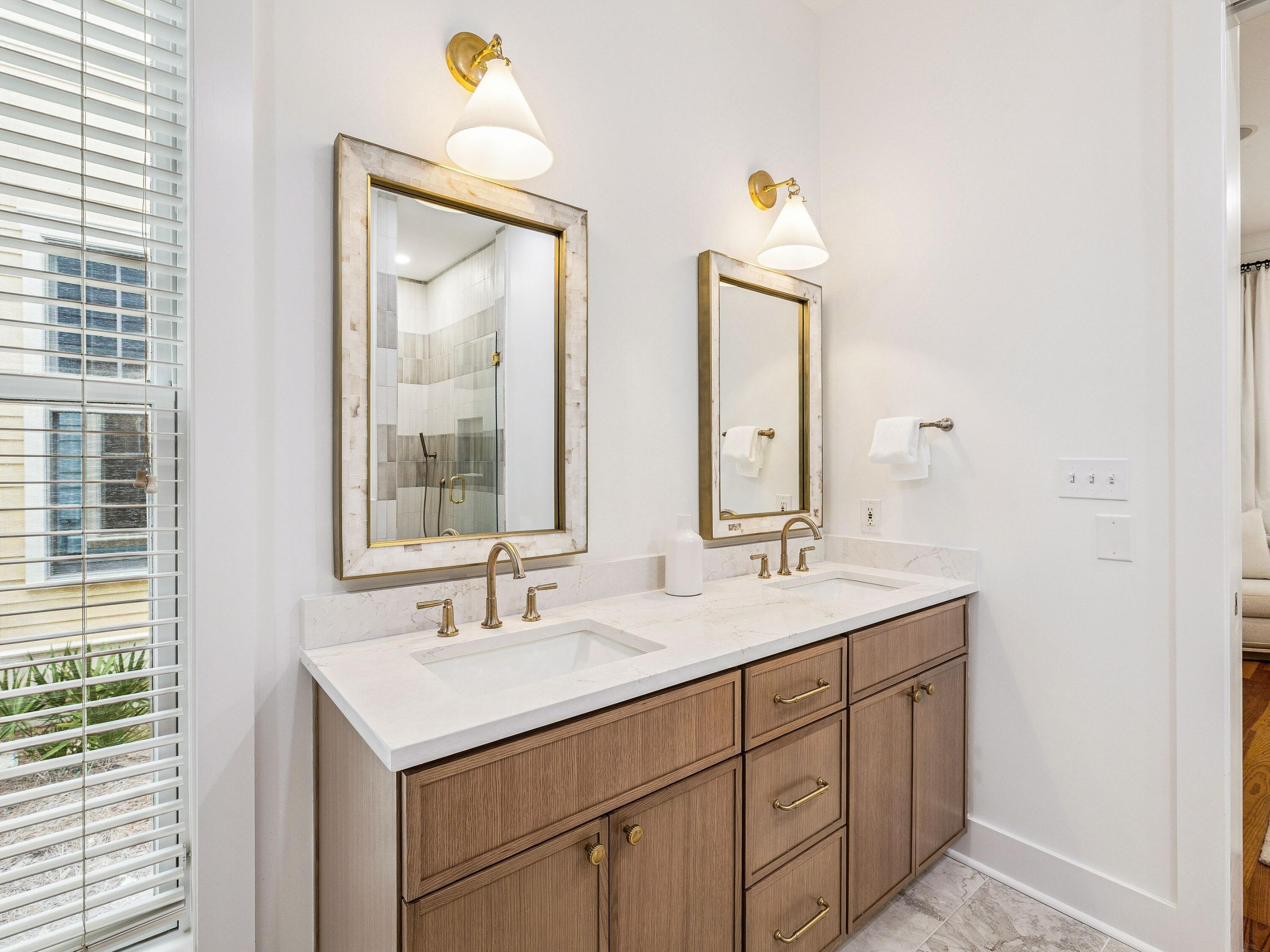 90 Silver Laurel Way Santa Rosa Beach, FL 32459 - Photo 25 of 45 a bathroom with 2 sink and a mirror