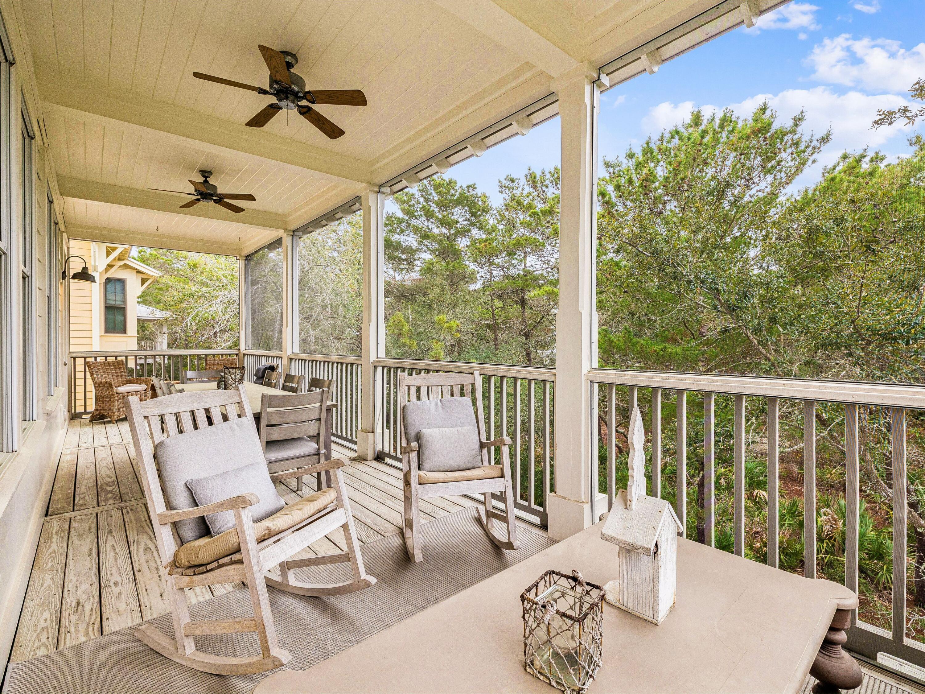 90 Silver Laurel Way Santa Rosa Beach, FL 32459 - Photo 29 of 45 a living room with large windows and wooden floor