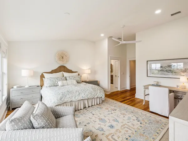 a bedroom with a large bed and a couch