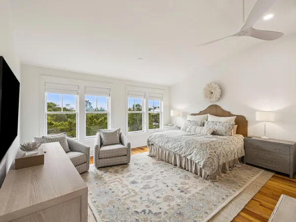 a bedroom with a large bed and a couch