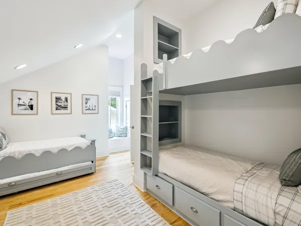 a bedroom with a bed and a view of kitchen