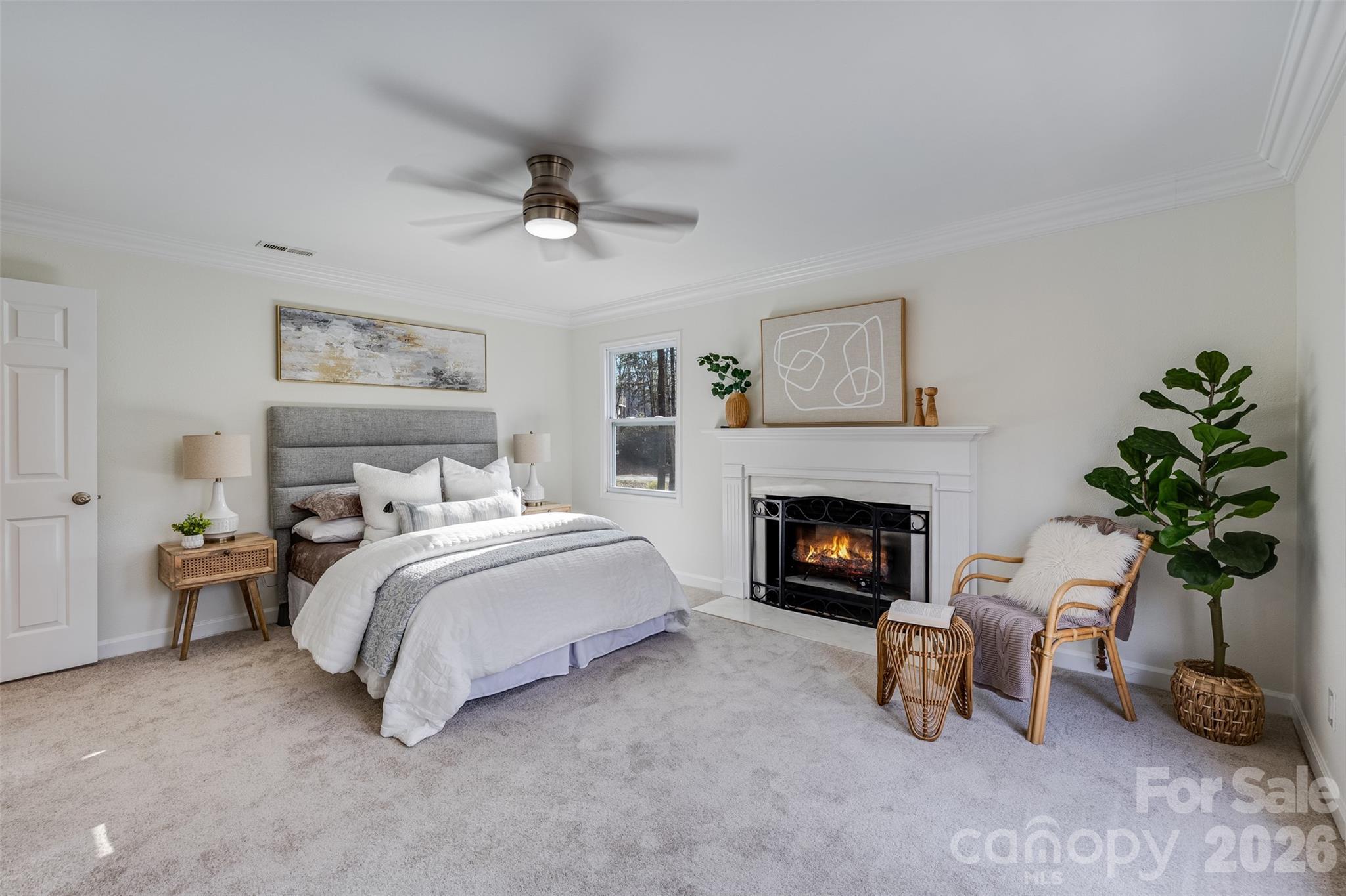 8 Hickory Ridge Court Lake Wylie, SC 29710 - Photo 16 of 37 a bed room with a bed and a fireplace