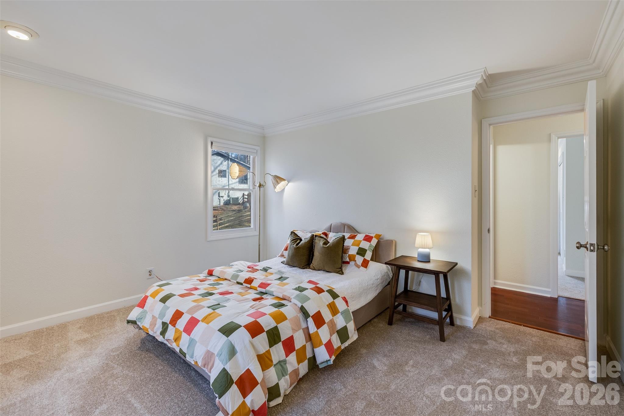 8 Hickory Ridge Court Lake Wylie, SC 29710 - Photo 21 of 37 a bedroom with a bed and a lamp