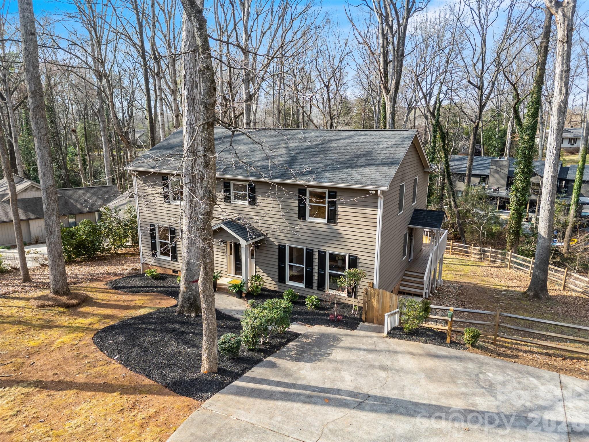 8 Hickory Ridge Court Lake Wylie, SC 29710 - Photo 4 of 37 a front view of a house with a yard