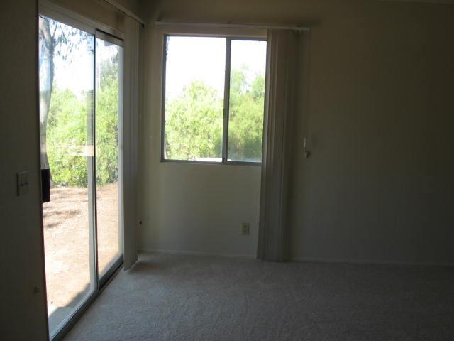 14281 Cane Road Valley Center, CA 92082 - Photo 11 of 24 Room features large window, sliding door, bathroom, and closet.