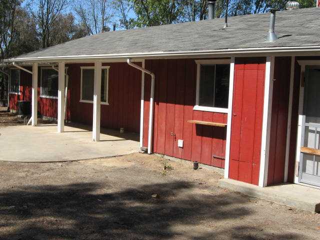 14281 Cane Road Valley Center, CA 92082 - Photo 16 of 24 Rear yard and patio on east side of house.