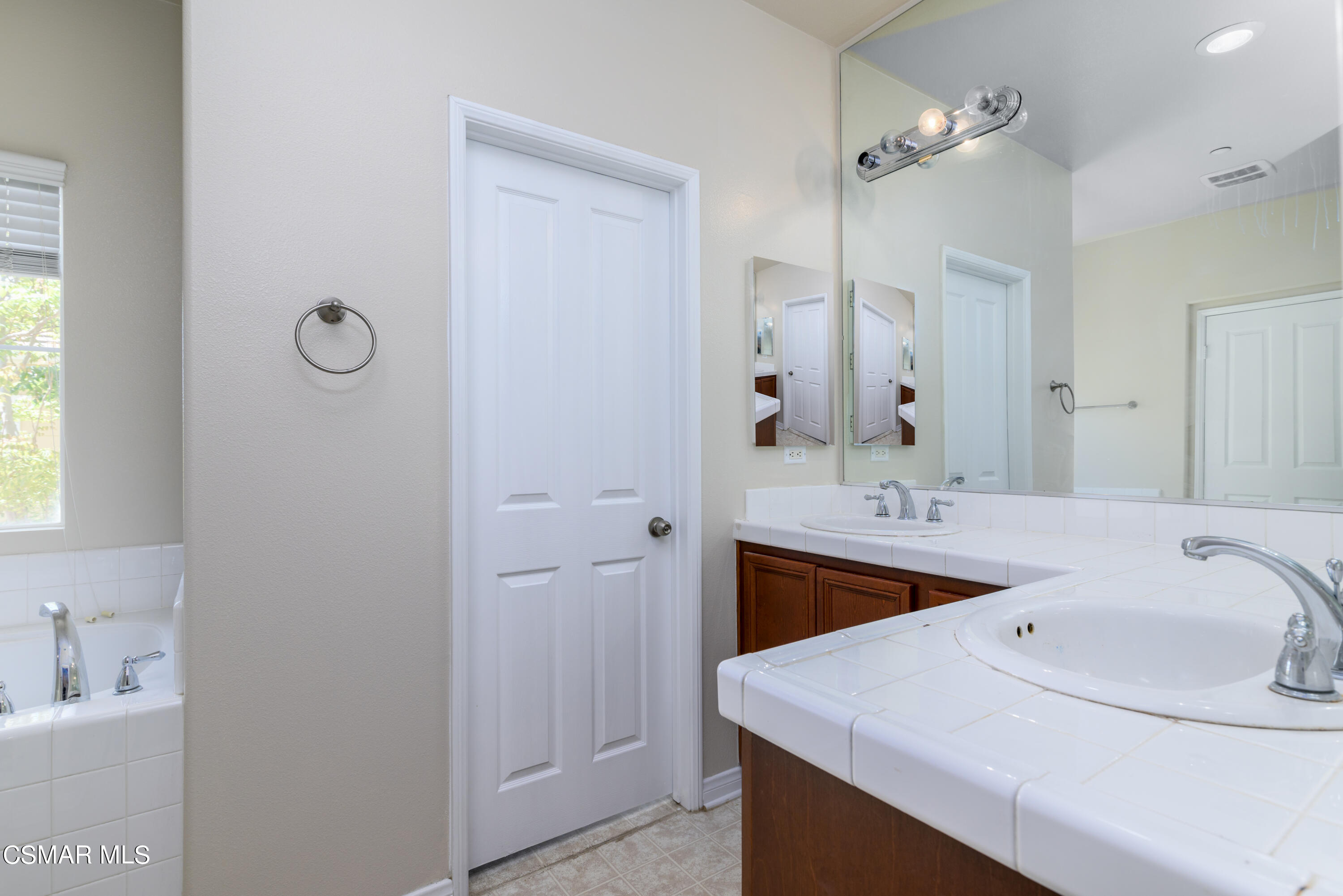 4120 Paredo Way, Unit C Simi Valley, CA 93063 - Photo 14 of 24 a bathroom with a sink and a mirror