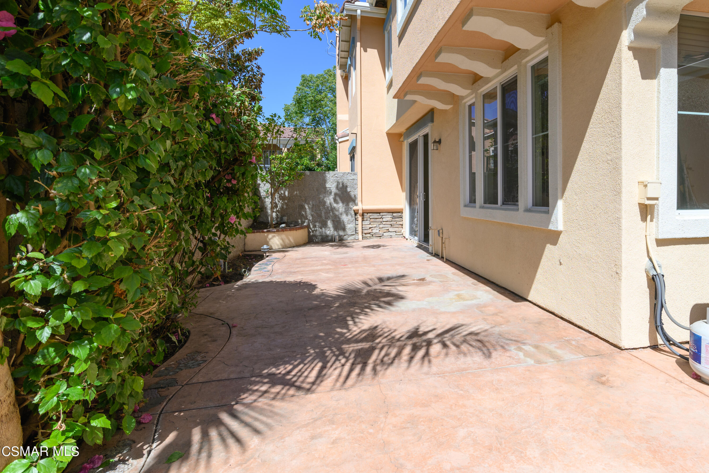 4120 Paredo Way, Unit C Simi Valley, CA 93063 - Photo 22 of 24 a view of backyard with large trees and plants