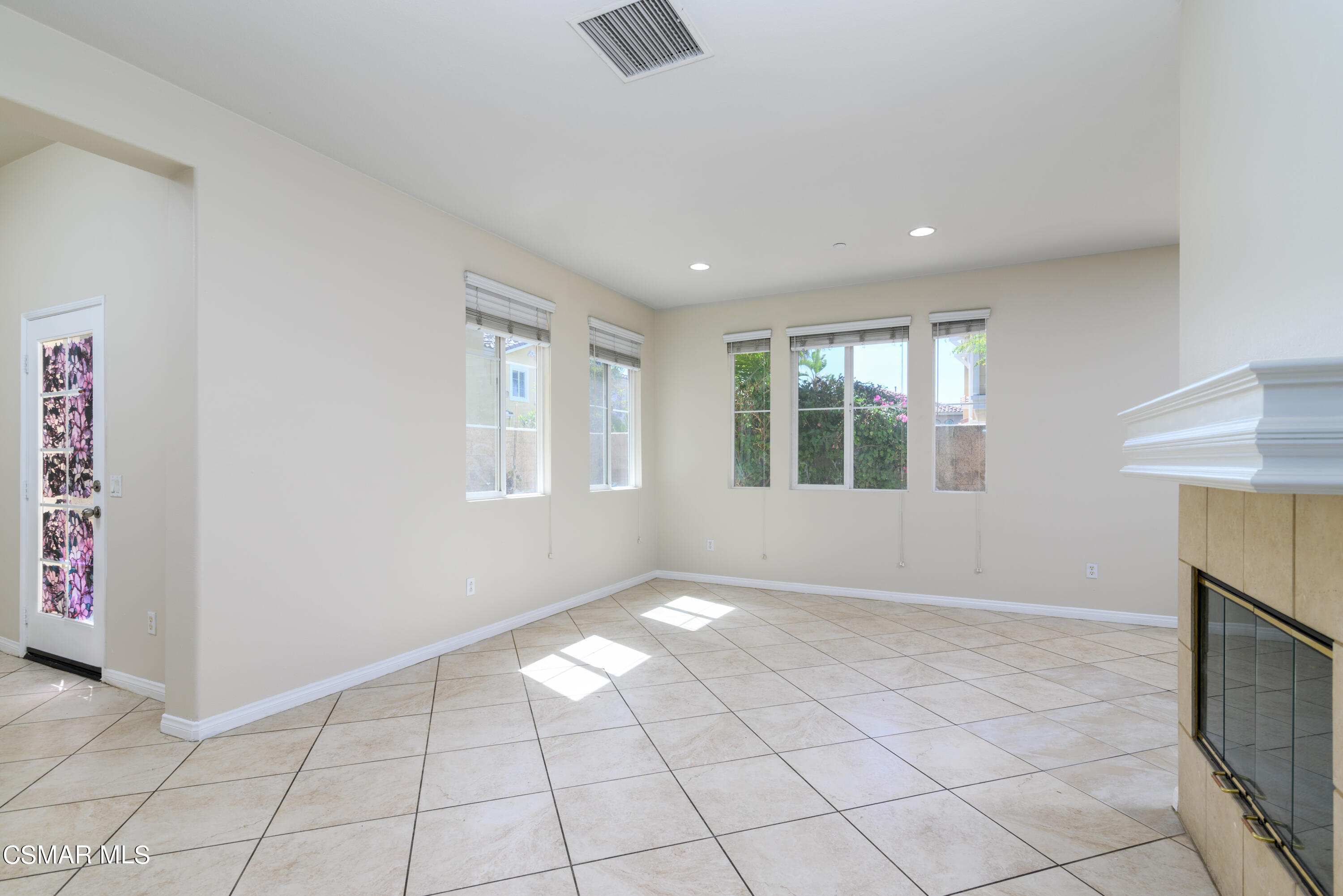 4120 Paredo Way, Unit C Simi Valley, CA 93063 - Photo 4 of 24 an empty room with windows and chandelier fan