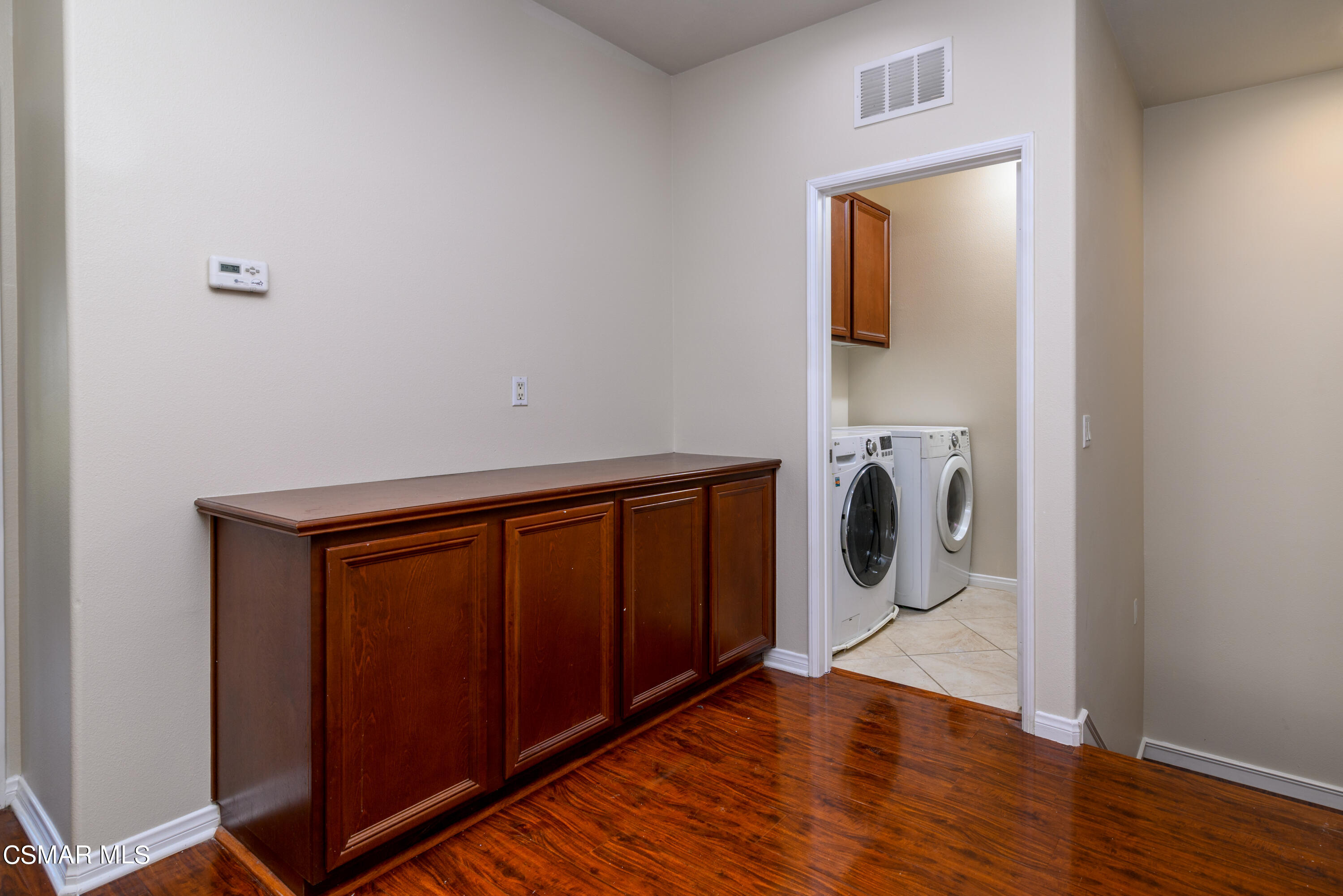 4120 Paredo Way, Unit C Simi Valley, CA 93063 - Photo 10 of 24 a view of a storage and utility room with wooden floor