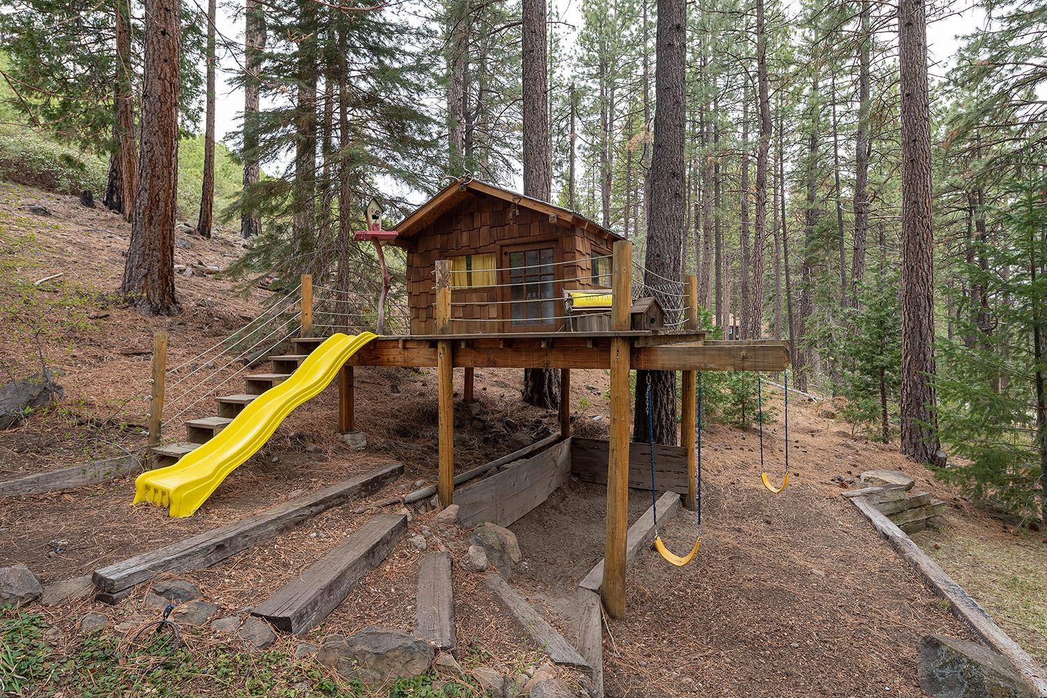626 Bear Valley Road Loyalton, CA 96118 - Photo 26 of 39 a view of a deck with a slide and wooden fence