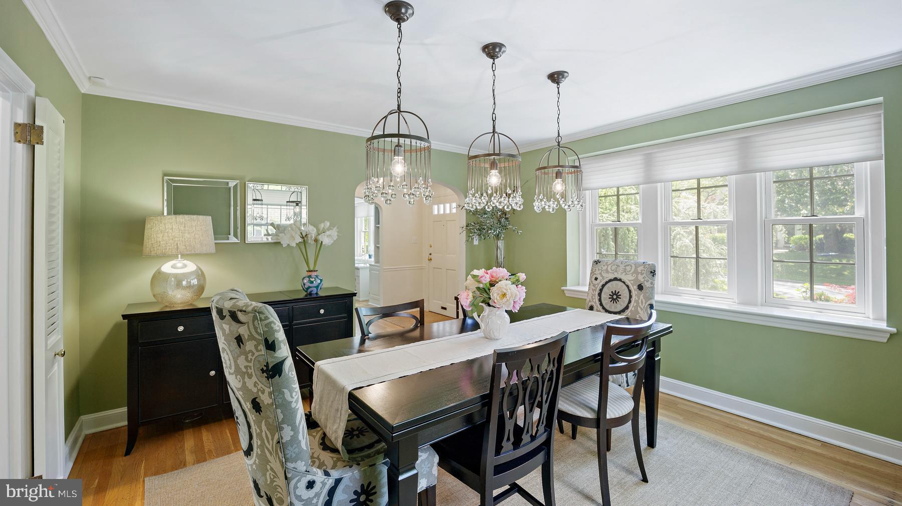 517 Monroe Road Merion Station, PA 19066 - Photo 14 of 40 a view of a dining room and livingroom with furniture wooden floor a chandelier