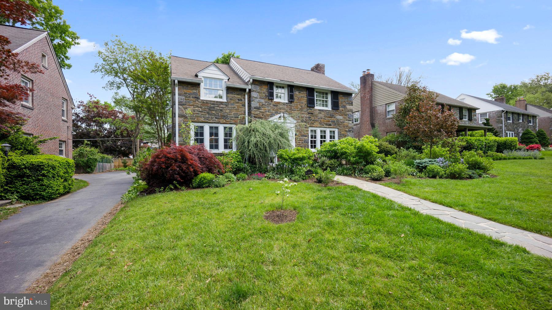 517 Monroe Road Merion Station, PA 19066 - Photo 4 of 40 a front view of a house with a yard