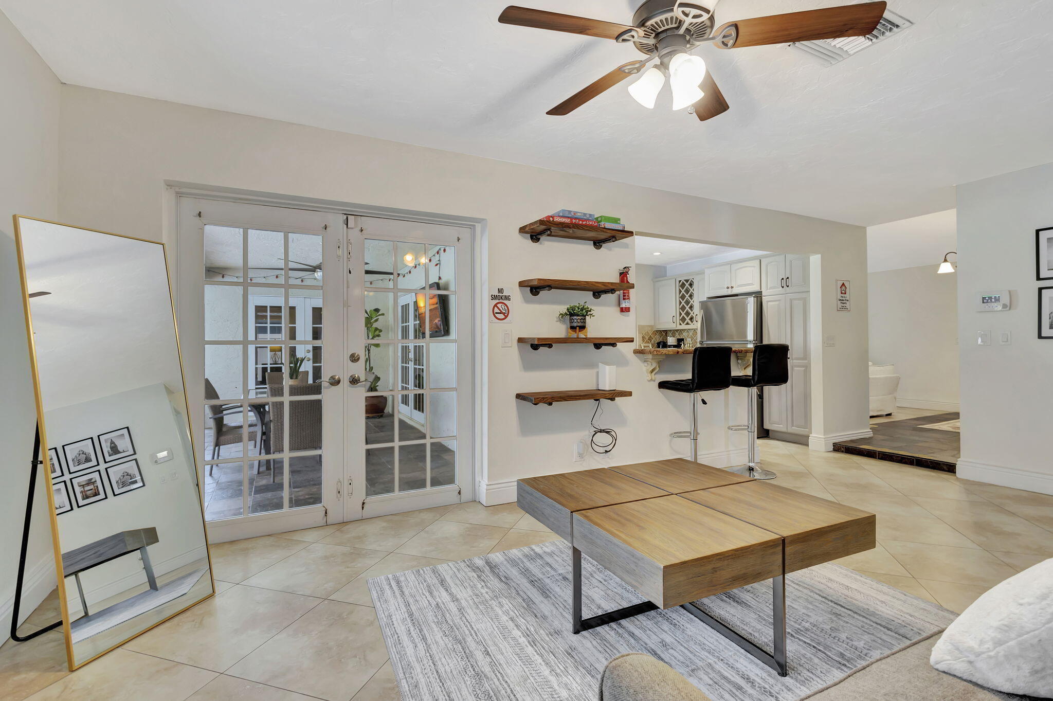 1104 Jackpine Street, Unit SEASON FURNISHED RENTAL) Wellington, FL 33414 - Photo 28 of 71 a living room with furniture a rug and kitchen view