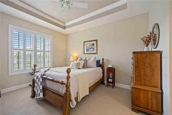 a bed room with a bed and a window