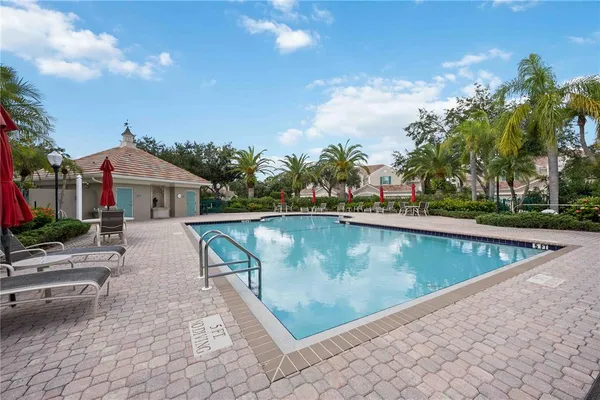 a view of a swimming pool with a lounge chairs