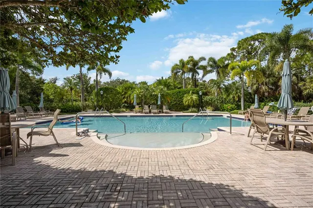 a view of a swimming pool with a patio