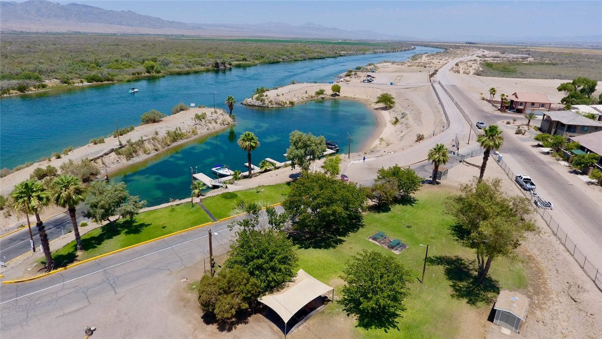 8257 Green Valley Road Mohave Valley, AZ 86440 - Photo 39 of 41 Aerial perspective showcasing a vibrant waterway with clear blue water and surrounding desert landscape