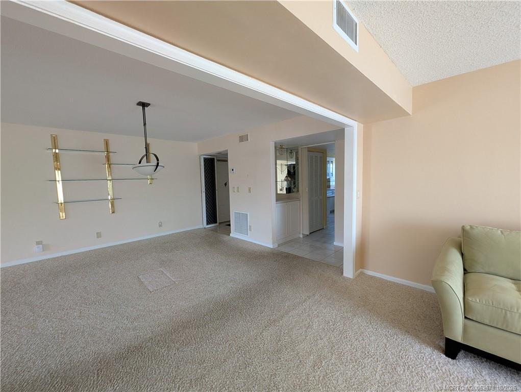 3100 Southeast Pruitt Road, Unit B301 Port St. Lucie, FL 34952 - Photo 11 of 48 a view of a livingroom with a furniture and window