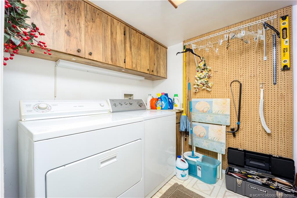 3100 Southeast Pruitt Road, Unit B301 Port St. Lucie, FL 34952 - Photo 13 of 48 a utility room with dryer and washer