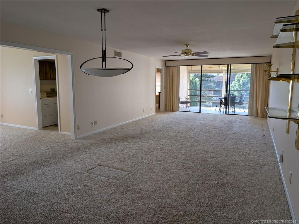 3100 Southeast Pruitt Road, Unit B301 Port St. Lucie, FL 34952 - Photo 14 of 48 a view of an empty room with a window