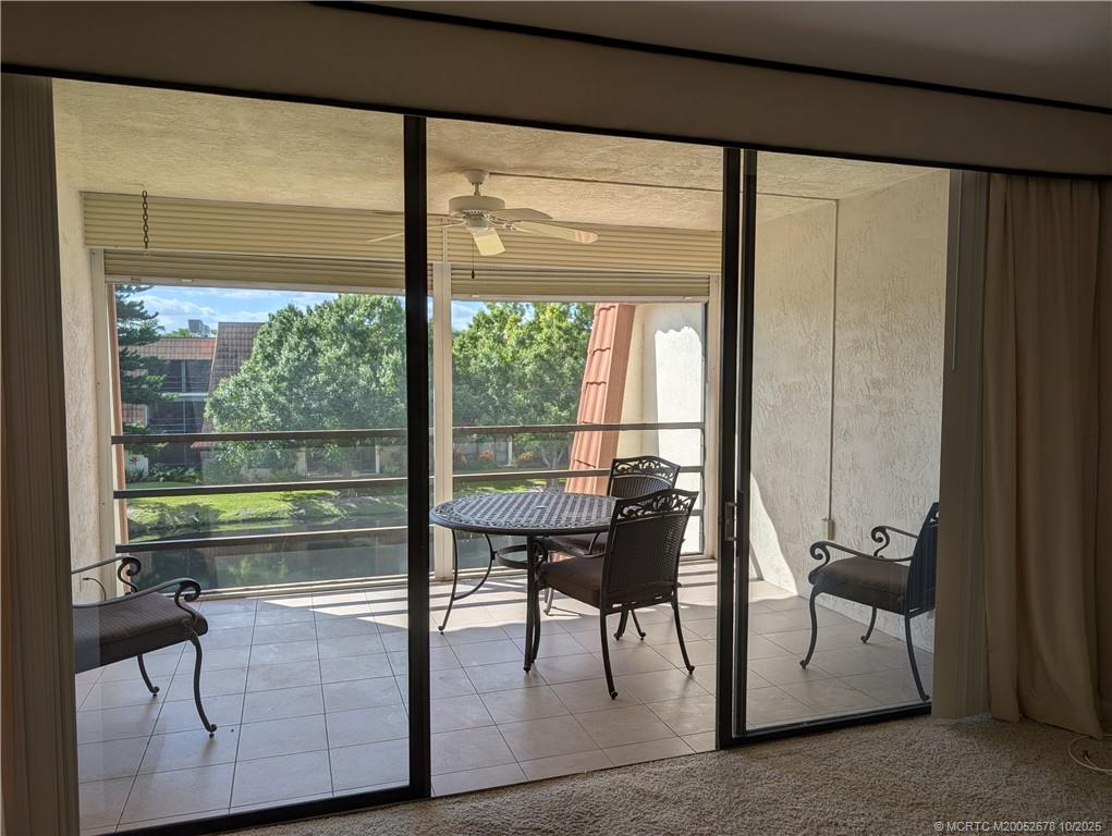 3100 Southeast Pruitt Road, Unit B301 Port St. Lucie, FL 34952 - Photo 15 of 48 a view of a floor to ceiling window and an outdoor view