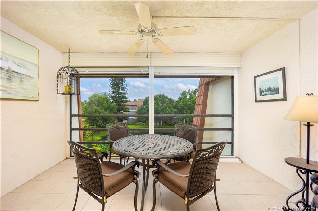 3100 Southeast Pruitt Road, Unit B301 Port St. Lucie, FL 34952 - Photo 16 of 48 a view of a dining room with furniture window and outside view