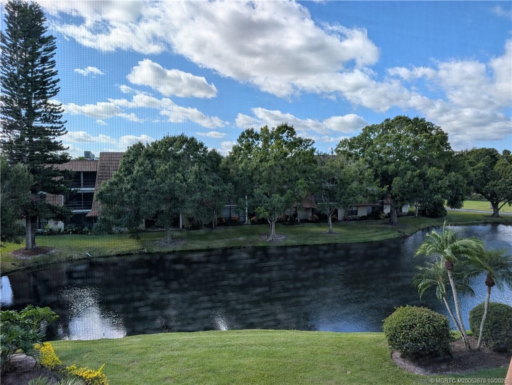 3100 Southeast Pruitt Road, Unit B301 Port St. Lucie, FL 34952 - Photo 17 of 48 a view of a garden with a building