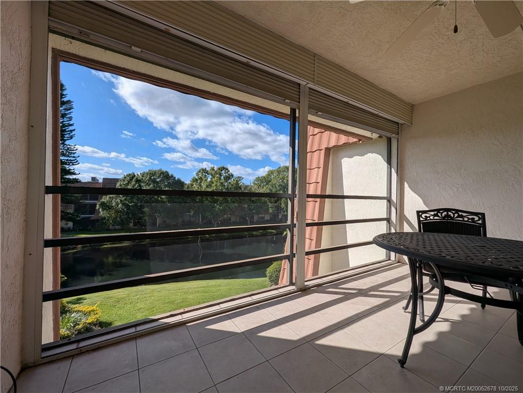 3100 Southeast Pruitt Road, Unit B301 Port St. Lucie, FL 34952 - Photo 18 of 48 a view of a two chair and table in the balcony