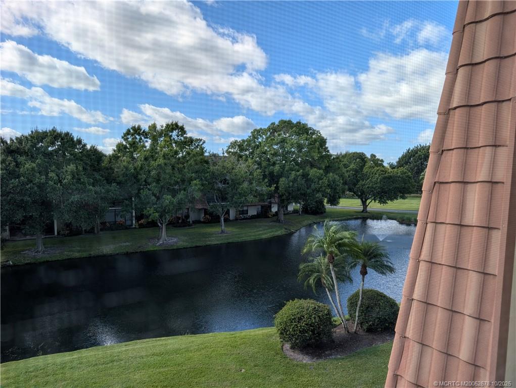 3100 Southeast Pruitt Road, Unit B301 Port St. Lucie, FL 34952 - Photo 19 of 48 a view of a lake from a yard