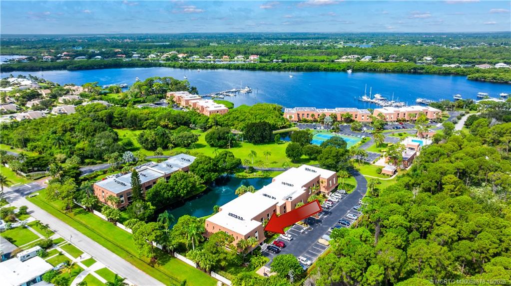 3100 Southeast Pruitt Road, Unit B301 Port St. Lucie, FL 34952 - Photo 2 of 48 a view of a lake with a city view