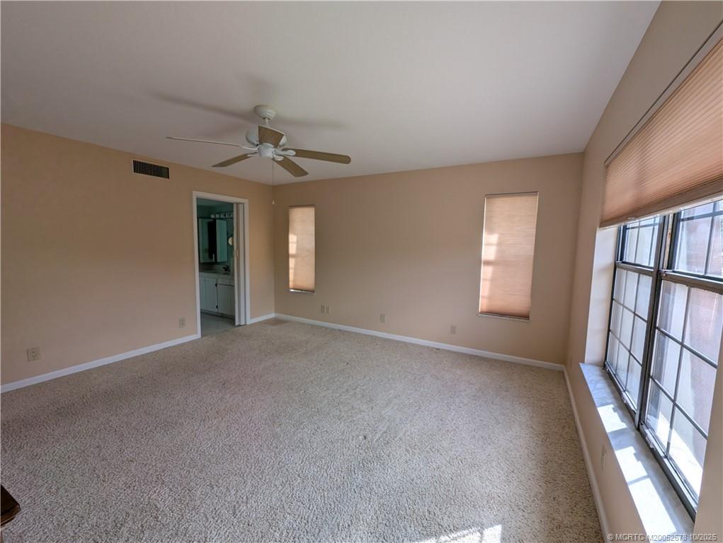 3100 Southeast Pruitt Road, Unit B301 Port St. Lucie, FL 34952 - Photo 21 of 48 a view of an empty room with a window