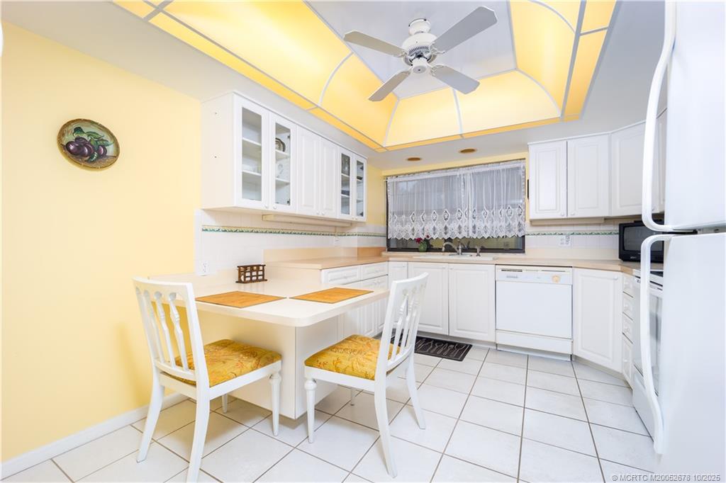 3100 Southeast Pruitt Road, Unit B301 Port St. Lucie, FL 34952 - Photo 29 of 48 a kitchen with a sink cabinets and window