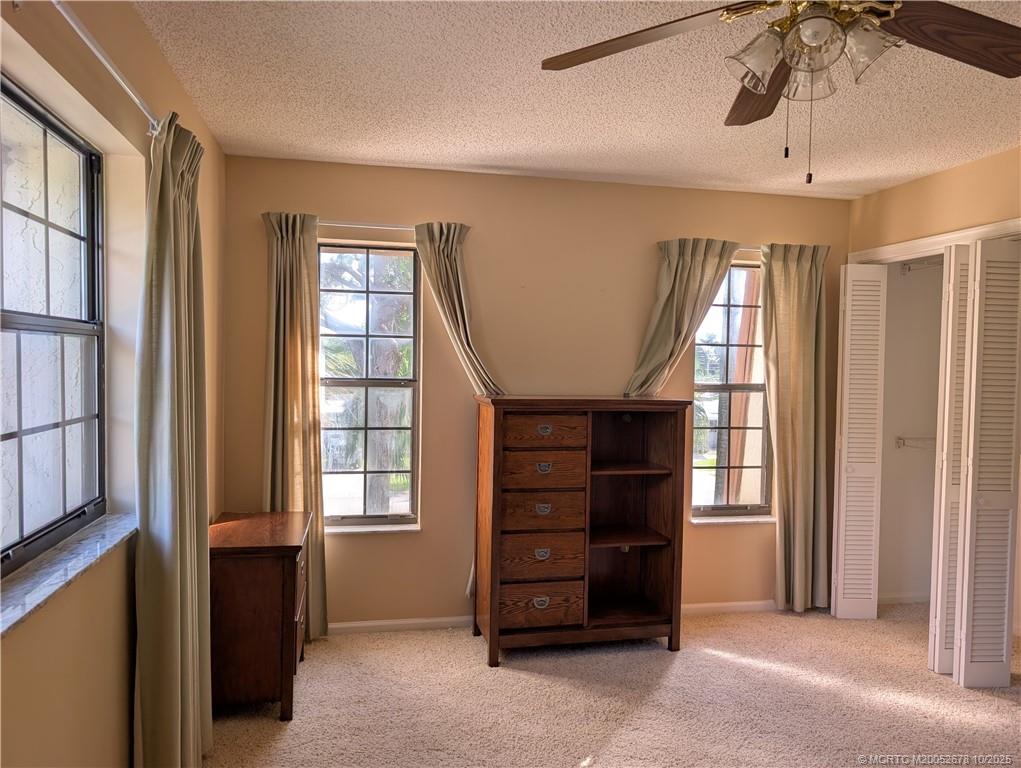 3100 Southeast Pruitt Road, Unit B301 Port St. Lucie, FL 34952 - Photo 34 of 48 a view of livingroom with furniture and windows