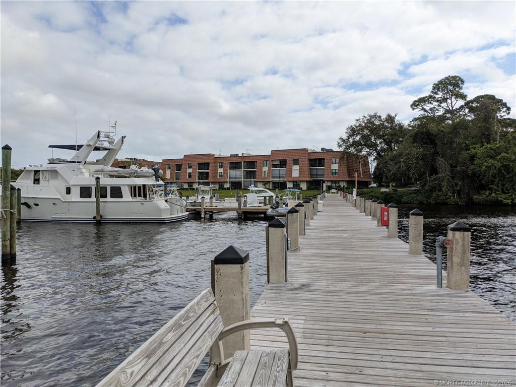 3100 Southeast Pruitt Road, Unit B301 Port St. Lucie, FL 34952 - Photo 39 of 48 a view of a roof deck with sitting area
