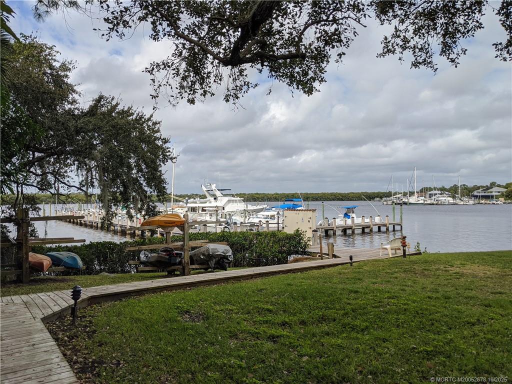 3100 Southeast Pruitt Road, Unit B301 Port St. Lucie, FL 34952 - Photo 45 of 48 a view of a big yard with table and chairs