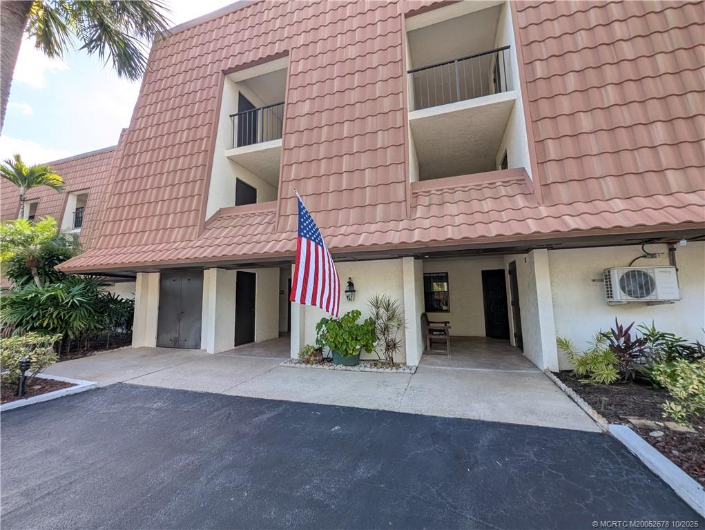 3100 Southeast Pruitt Road, Unit B301 Port St. Lucie, FL 34952 - Photo 6 of 48 a front view of a house with hallway