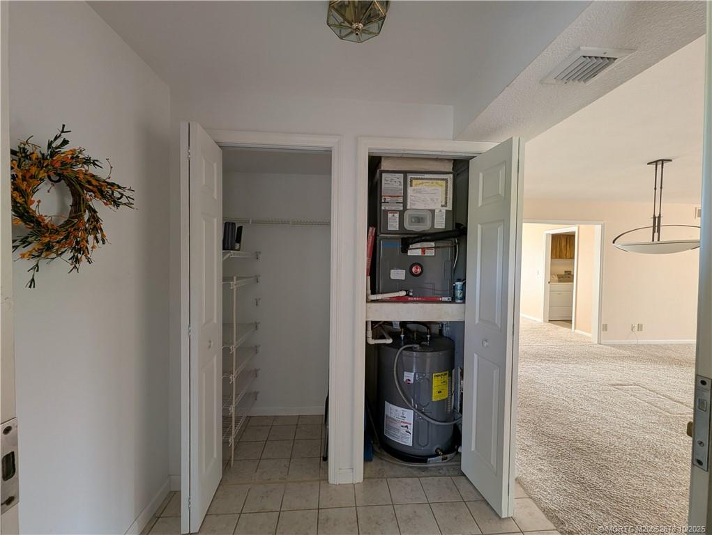 3100 Southeast Pruitt Road, Unit B301 Port St. Lucie, FL 34952 - Photo 10 of 48 a view of an entryway and livingroom