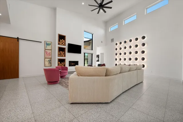 a living room with furniture and flat screen tv