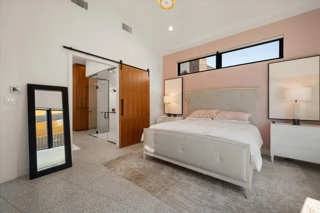 a bathroom with a double vanity sink a mirror and a shower