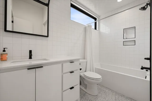 a bedroom with a bed and wall painting