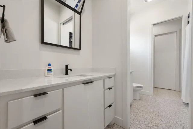 a bathroom with a toilet and a sink