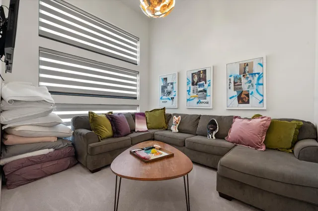 a view of an house with backyard and porch