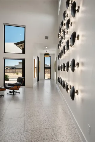 wooden floor in a hall with a cabinet and mirror