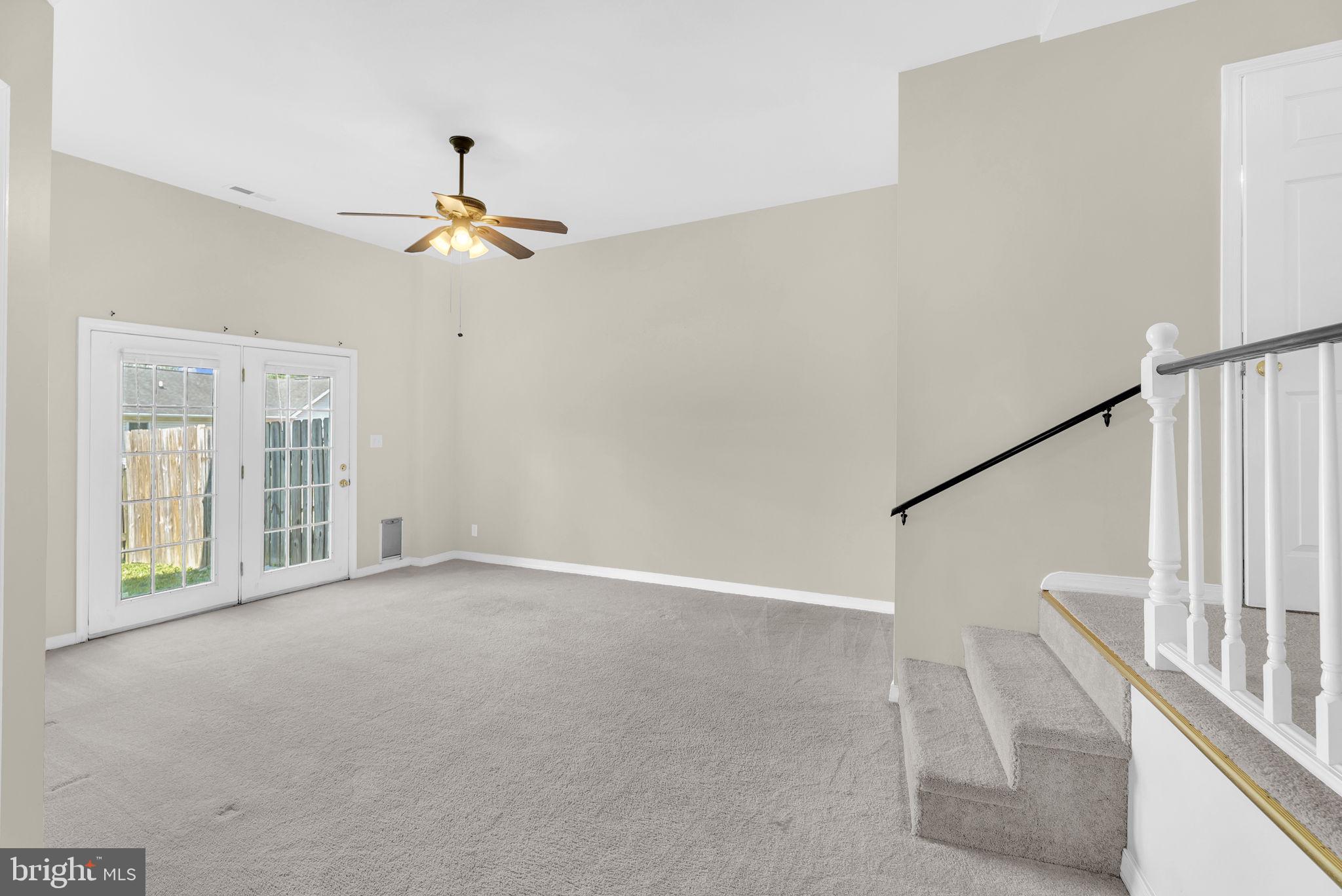 555 Oak Lee Drive Ranson, WV 25438 - Photo 30 of 40 Family room with french doors to outside